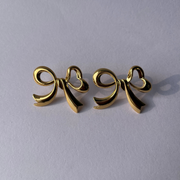 Golden Bow Statement Studs